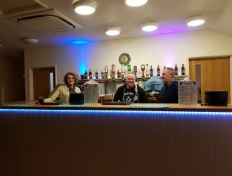 Bar volunteers ready for the doors to open December 2022